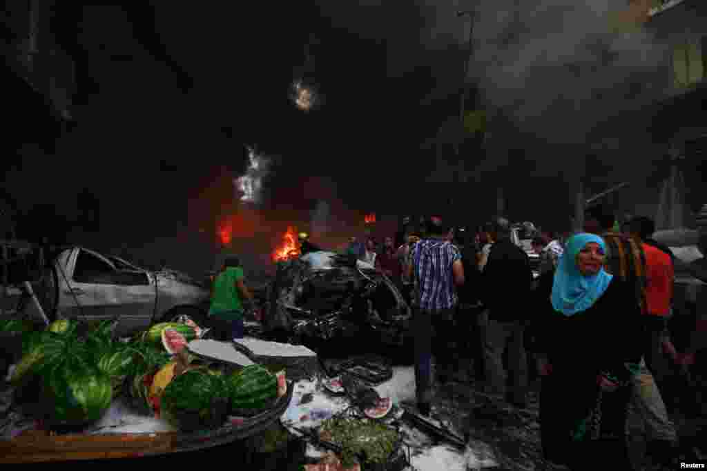 A woman cries at the site of an explosion in Beirut's southern suburbs, August 15, 2013.