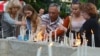 People light and place candles in memory of Ukrainian servicemen killed when their transport plane was downed by pro-Russian rebels in Luhannk region, in a central square of Ukraine's western city of Lviv, June 14, 2014.