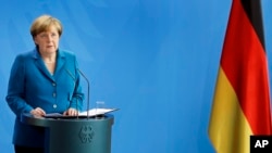 FILE - German Chancellor Angela Merkel addresses the media in Berlin, July 23, 2016. A drubbing in the eastern state of Mecklenburg-Vorpommern two weeks ago triggered calls from Merkel's conservative allies in Bavaria to toughen up her migrant policy.