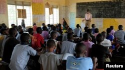 Students attend a class at the Sweswe Primary School after schools reopened following the COVID-19 shutdown in Kyaka II Refugee Settlement, in Kyegegwa District, Uganda, Jan. 11, 2022. 