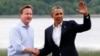 Britain's Prime Minister David Cameron (L) welcomes U.S. President Barack Obama on his arrival to the Lough Erne golf resort where the G8 summit is taking place in Enniskillen, Northern Ireland,l June 17, 2013. 