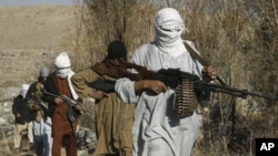 Taliban fighters in an undisclosed location in Nangarhar province, Afghanistan, December 13, 2010