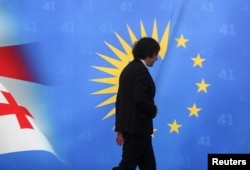 Georgian Prime Minister Irakli Kobakhidze leaves after a press conference in Tbilisi, Georgia, on Nov. 28, 2024. Kobakhidze's ruling party, Georgian Dream, announced that it would suspect talks on joining the European Union until 2028.