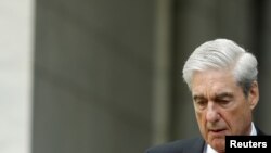 FILE - Former Special Counsel Robert Mueller departs from the U.S. Capitol following his testimonies before the House of Representatives, on Capitol Hill in Washington, July 24, 2019.