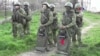Reservists drafted during the partial mobilization line up outside a recruitment office in the Siberian town of Tara in the Omsk region, Russia.