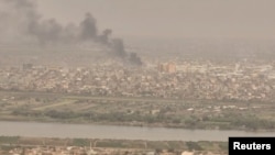 A drone view shows smoke rising over the Khartoum North Light Industrial Area, in Bahri, Sudan, April 23, 2023, in this still image taken from video obtained by Reuters. (Video obtained by Reuters/ via REUTERS)