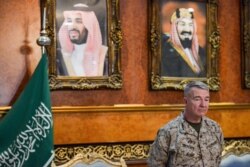 FILE - U.S. Marine Corps General Kenneth F. McKenzie, Commander of the U.S. Central Command, poses for a picture during his visit to a military base in al-Kharj in central Saudi Arabia, July 18, 2019.