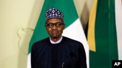 Nigerian President Muhammadu Buhari attends a press briefing after meeting with South African President Cyril Ramaphosa in Pretoria, South Africa Thursday, Oct. 3, 2019.