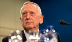 FILE - U.S. Secretary of Defense Jim Mattis waits for the start of the North Atlantic Council at NATO headquarters in Brussels, Feb. 15, 2017.