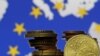 Euro coins are seen in front of displayed flag and map of European Union in this picture illustration taken in Zenica, Bosnia and Herzegovina, May 28 2015.