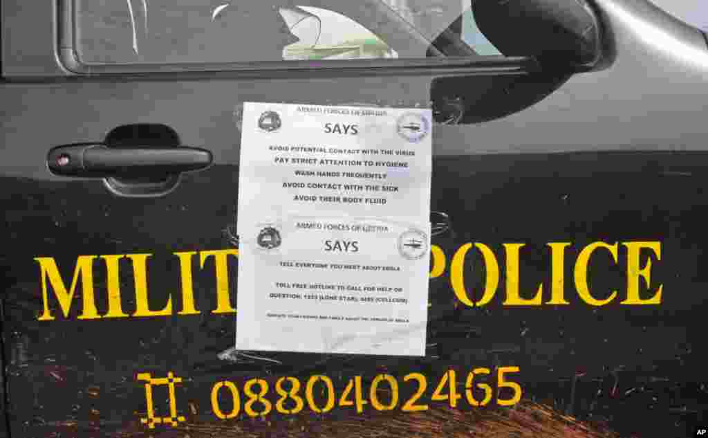A Liberian military police truck with information on the prevention of Ebola patrols through the city, Monrovia, Liberia, August 1, 2014. 