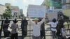 Members of the Association of Democracy and Independent Economy, workers and land dispute victims welcomed the release of the 25 on Friday May 30, 2014.
