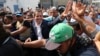 Venezuela's self-proclaimed president Juan Guaido greets supporters in Caracas, Venezuela, April 30, 2019.
