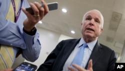 FILE - Sen. John McCain speaks to reporters in Washington, March 8, 2017.