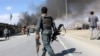 FILE - Afghan security forces respond to a suicide attack in Kabul, Afghanistan, March 1, 2017.