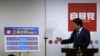 Japan's Prime Minister Shinzo Abe explains his three new arrows of 'Abenomics' policy, during a news conference after he was reelected as the party leader at the party headquarters in Tokyo, Sept. 24, 2015. 