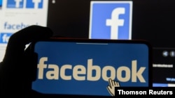 FILE - Facebook logos are seen in an illustration photo.