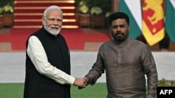 India's Prime Minister Narendra Modi (L) and Sri Lanka's President Anura Kumara Dissanayake shake hands before their meeting at the Hyderabad House in New Delhi on Dec. 16, 2024.