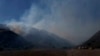 Thousands evacuate as Northern California wildfire spreads, more hot weather expected