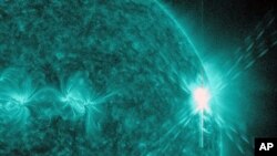 This image provided by NASA shows a solar flare, the largest in 5 years. The image was was captured by NASA's Solar Dynamics Observatory (SDO) in extreme ultraviolet light at 131 Angstroms. Scientists say the bursts of radiation hurled by the solar blast