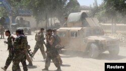 Afghan Commando forces are seen at the site of a battle field where they clash with the Taliban insurgent in Kunduz province, June 22, 2021.