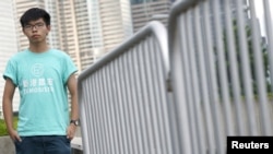 Hong Kong student leader Joshua Wong poses for a photo, a day before an appeal verdict on charges relating to 2014 pro-democracy "Umbrella Movement," also known as "Occupy Central" protests, in Hong Kong, Aug. 15, 2017.