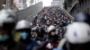 Commuters wear face masks to protect themselves from the coronavirus during the morning rush hour in Taipei, Taiwan.
