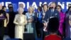 Britain's Prince Charles and Queen Elizabeth II are joined on stage with the rest of the Royal family as well as performers at the Queen's Jubilee Concert in front of Buckingham Palace, London, June 4, 2012. 