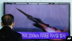 FILE -- A South Korean man watches a TV news program showing file footage of a missile launch conducted by North Korea, at Seoul Railway Station in Seoul, South Korea, March 13, 2015. 