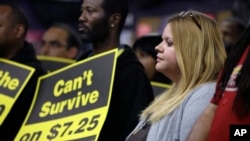 FILE - Amy Jennewein participates in a rally in support of raising the minimum wage University City, Mo. 