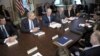 Vice President Joe Biden, center, with Attorney General Eric Holder at left, speaks during a meeting with victims' groups and gun safety organizations in the Eisenhower Executive Office Building on the White House complex in Washington, Wednesday, Jan. 9,