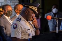 Head of Haitian National Police, Leon Charles, pauses during a news conference in Port-au-Prince