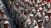 Militia members stand at attention during a ceremony with Venezuela's President Nicolas Maduro at Miraflores Palace in Caracas, April 17, 2017.