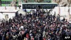 زمان اجرای توافق خروج شورشیان از غوطه شرقی، در صورت صحت داشتن، هنوز مشخص نیست. (عکس از آرشیو)