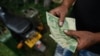 Zimbabwe Promises New Currency in Dollar Shortage