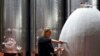 FILE - Cellar Master Elunda Basson works at the Steenberg vineyard in Constantia, Cape Town, South Africa, May 27, 2020. 