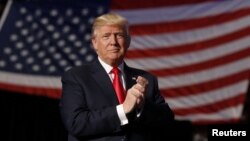 FILE - Donald Trump, at the time still President-elect, arrives to speak during a "Thank you" tour event at Giant Center in Hershey, Pennsylvania, Dec. 15, 2016.