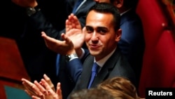 Five Star Movement leader Luigi Di Maio applauds the new Chamber of Deputies president Roberto Fico during the second session of parliament in Rome, Italy, March 24, 2018. 