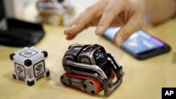 FILE- Anki's Cozmo coding robot is on display at CES International in Las Vegas, Jan. 10, 2018. Cozmo, which debuted in 2016, could be linked with an app called Code Lab that allowed users to drag and drop blocks of code that controlled its movements.