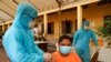 FILE PHOTO: Cambodian army members vaccinate people in Phnom Penh