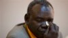 Clement Abaifouta, president of the association of victims of former Chadian dictator Hissène Habré , wipes away tears while listening to fellow victims recount their stories, at a press conference in Dakar, Senegal, Wednesday, July 17, 2013. Abaifouta, a