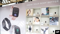 FILE - Fitbit devices are displayed in New York, Aug. 27, 2019.