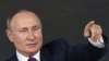 Presiden Rusia Vladimir Putin berbicara kepada awak media dalam sebuah kesempatan di Moskow, Rusia, pada 23 Desember 2021. (Foto: AFP/Natalia Kolesnikova)