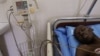 A male patient lies in a ward that specializes in the treatment of AIDS at a hospital in Dakar, Senegal Thursday, Dec. 1, 2005. 