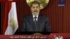 In this image made from video, Egyptian President Mohammed Morsi delivers a televised statement in Cairo, Egypt, Thursday, Dec. 6, 2012.