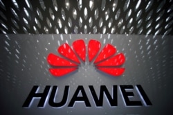 FILE PHOTO: A Huawei company logo at Shenzhen International Airport in Shenzhen, Guangdong province, China, July 22, 2019.