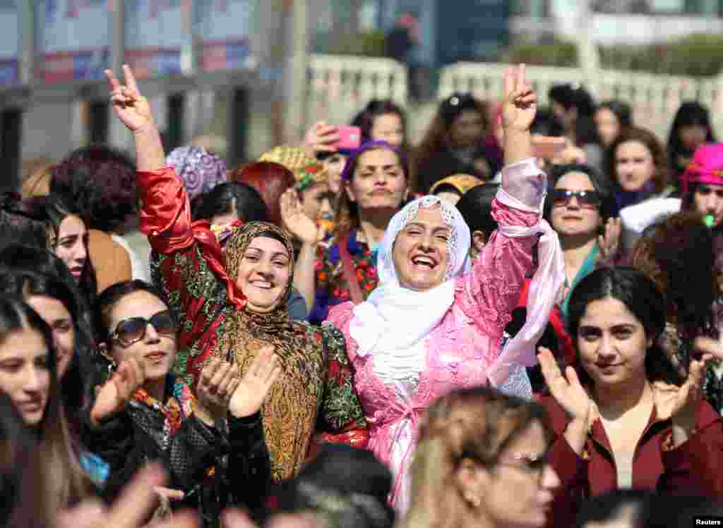 Participants dance during an International Women's Day rally in the Kurdish-dominated southeastern city of Diyarbakir, Turkey, March 8, 2017.