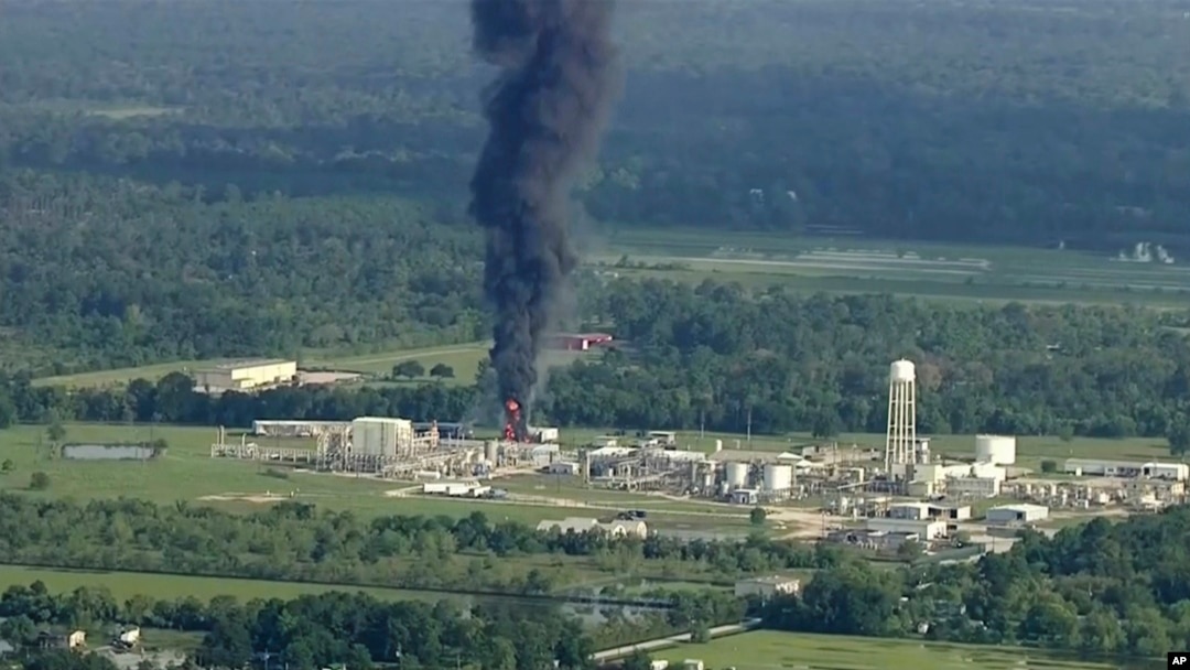 Smoke rises from a chemical plant in Crosby, near Houston, Texas, Sept. 1, 2017. Thick black smoke and towering orange flames shot up Friday from the flooded Houston-area chemical plant after two trailers of highly unstable compounds blew up a day earlier