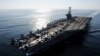 In this Nov. 12, 2011 photo provided by the U.S. Navy, the Nimitz-class aircraft carrier USS John C. Stennis (CVN 74) transits the Straits of Hormuz.
