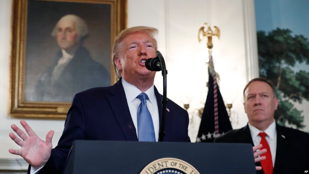 President Donald Trump, accompanied by Secretary of State Mike Pompeo, speaks Oct. 23, 2019, in the Diplomatic Room of the White House in Washington. 